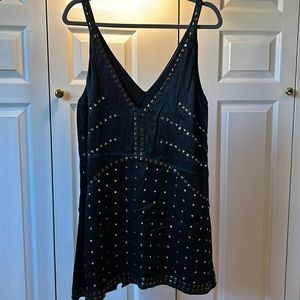 Anthropologie size M, black mini dress. Metallic geometric embellishments